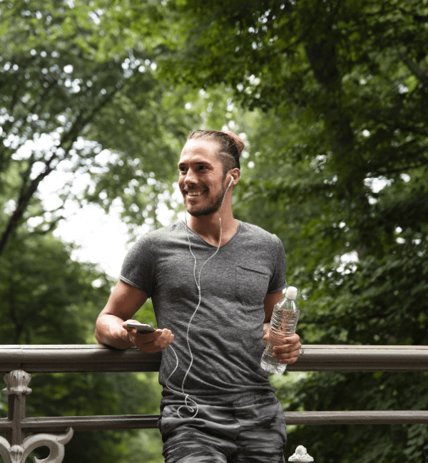 runner-leaning-metal-fence